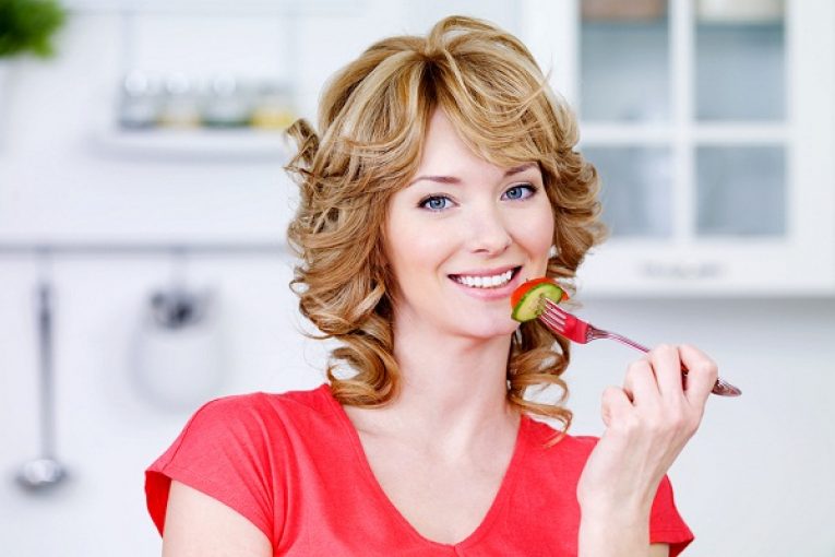 woman eating salad